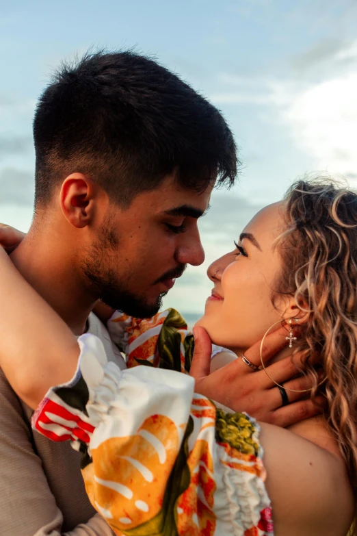 man and woman emcing with arms around each other