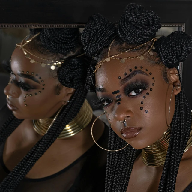 two woman are wearing jewelry and gold accessories