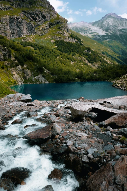 mountain lake with small water rushing in it