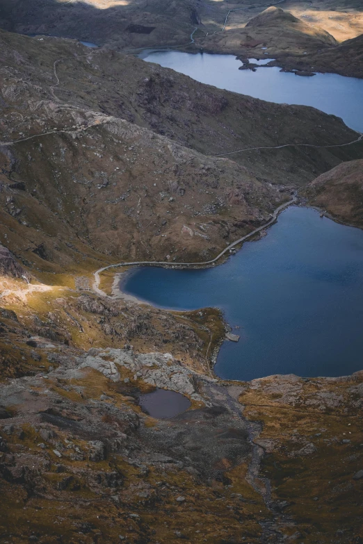 looking down at some mountains with water