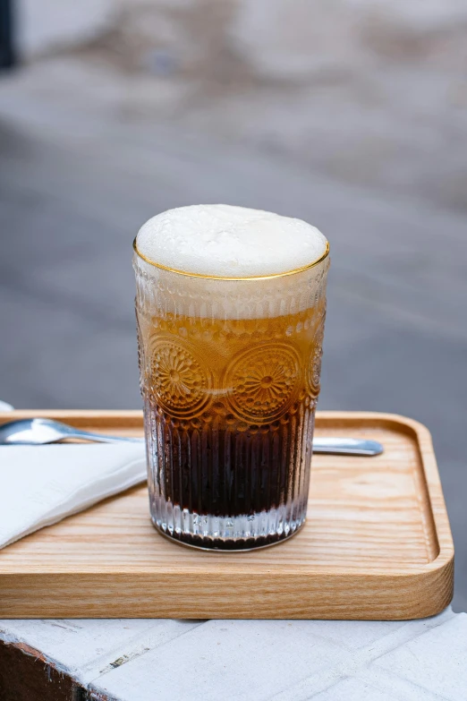 a frosted beverage is shown in an ice filled glass