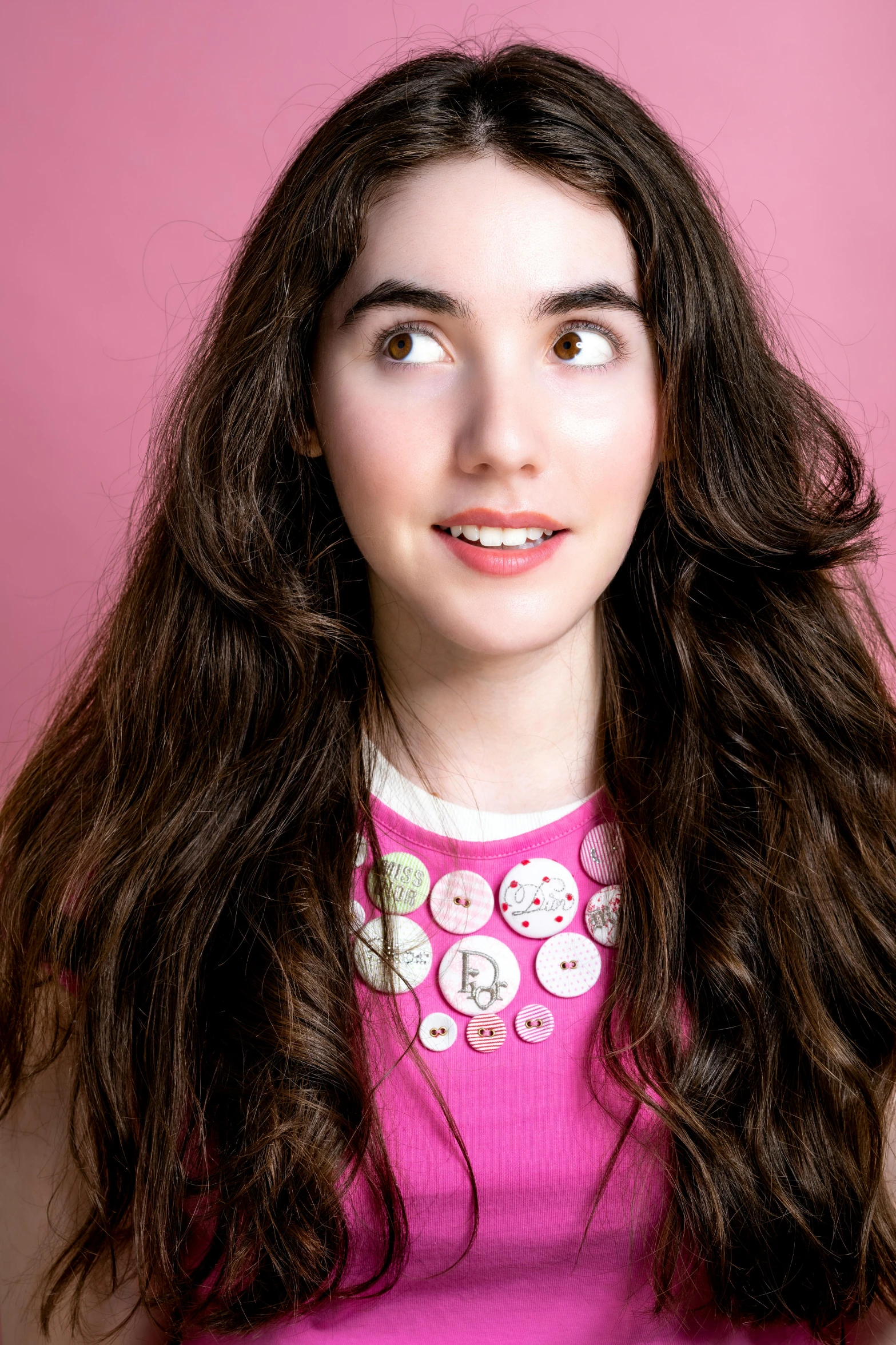 a pretty young lady with long brown hair