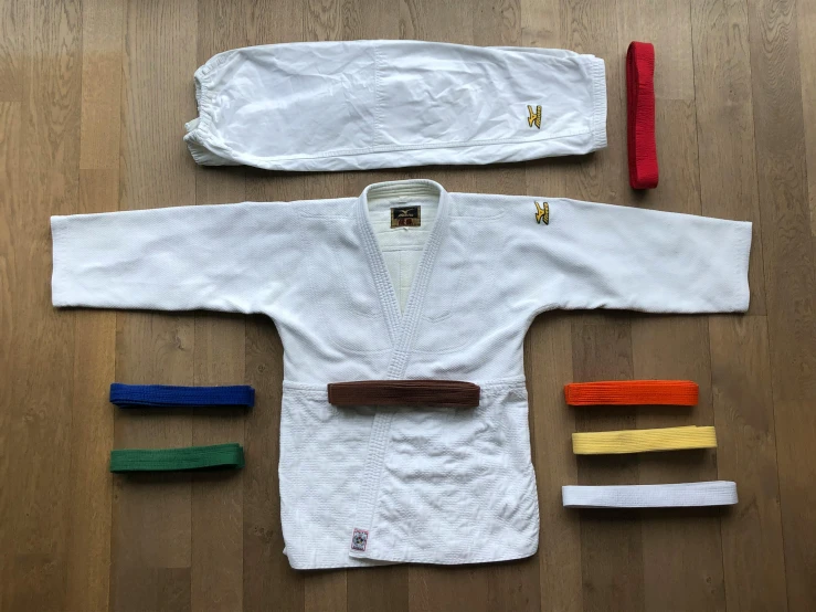 a set of karate gear is laid out on the floor