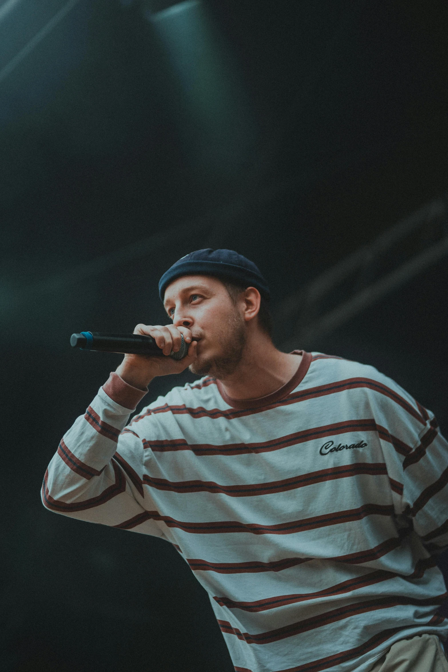 a man holding a microphone up to his mouth