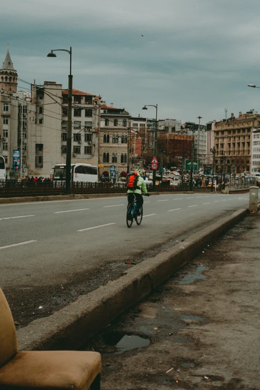 the men are riding bikes down the road together