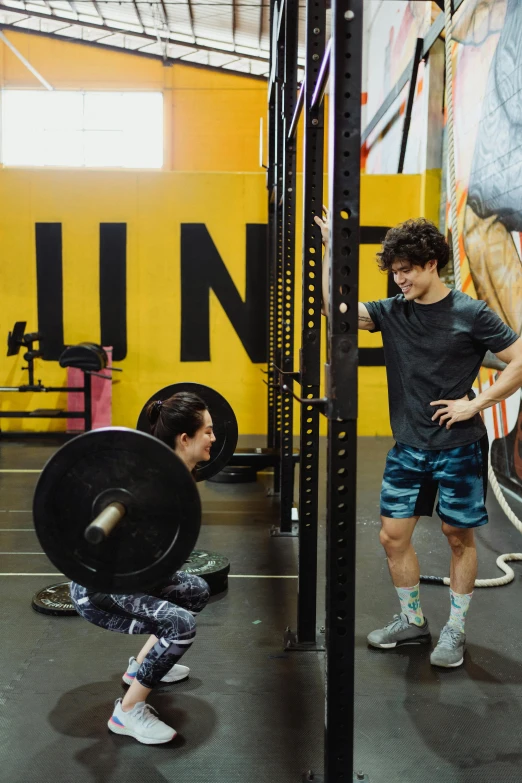 a couple of people working on squats