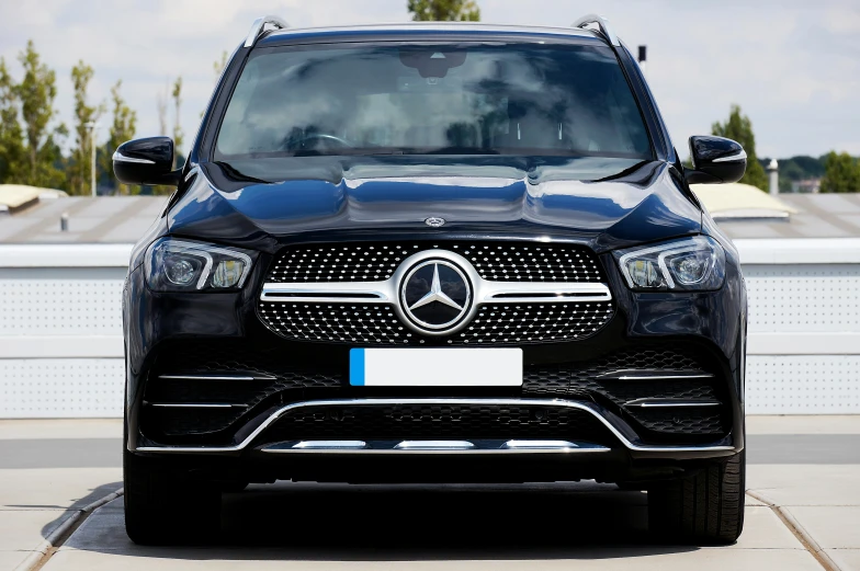 the front end of a black mercedes benz suv