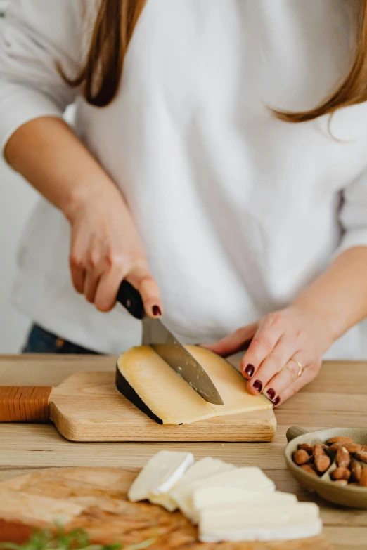 a person with their hands holding a knife