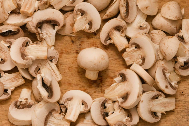a close up of mushrooms on a  board