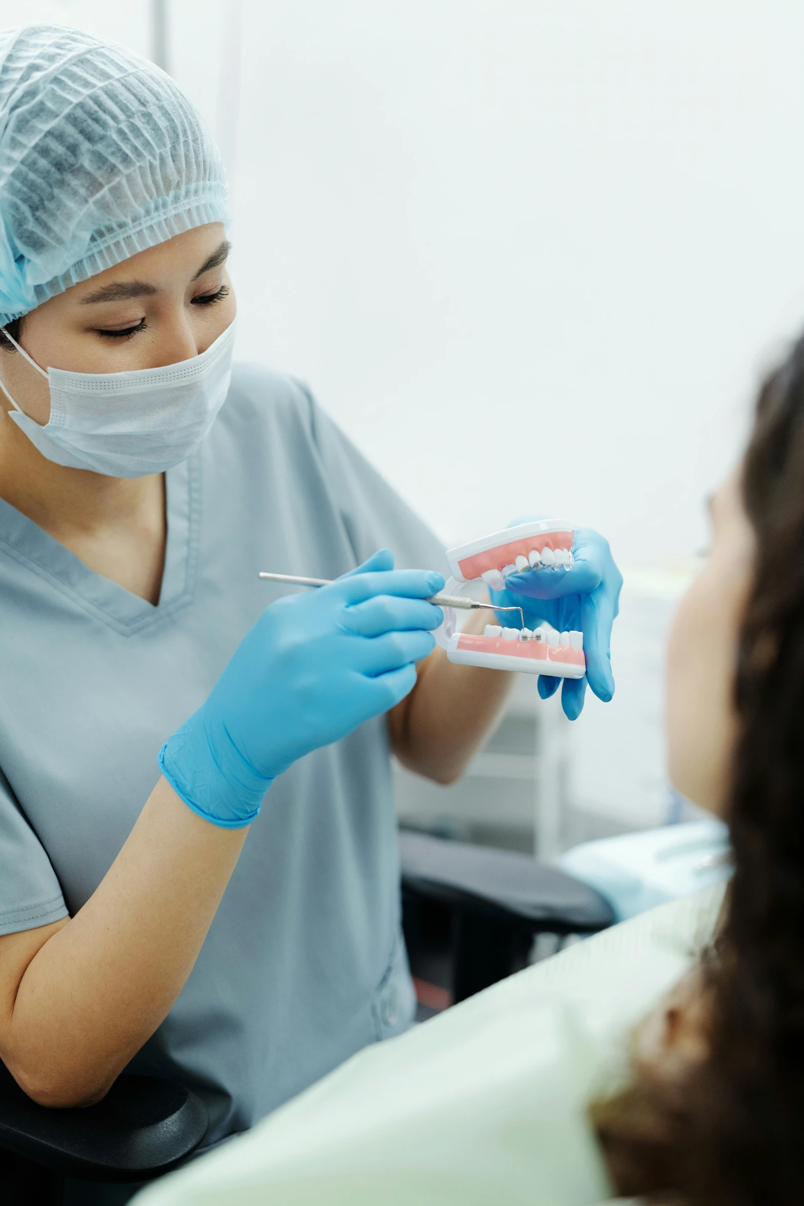 a woman getting her teeth checked before it's gone