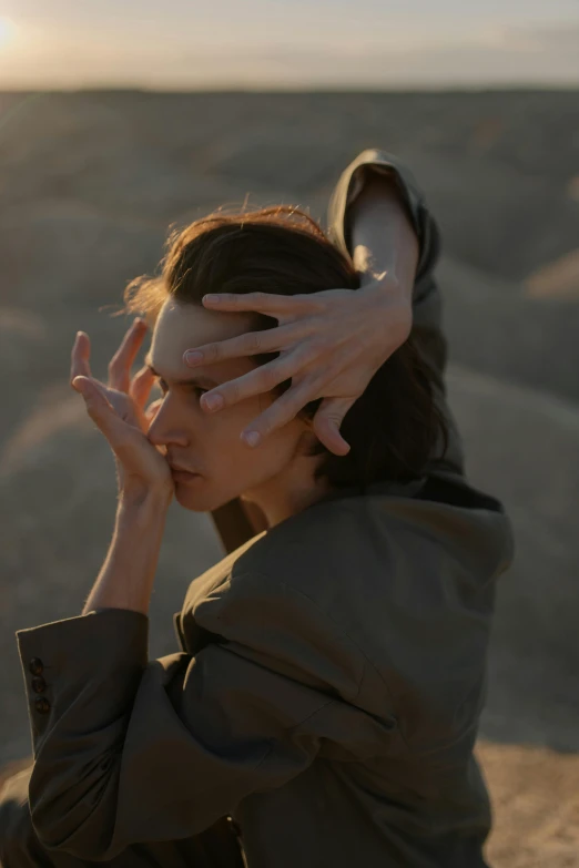 a woman covering her face with her hands