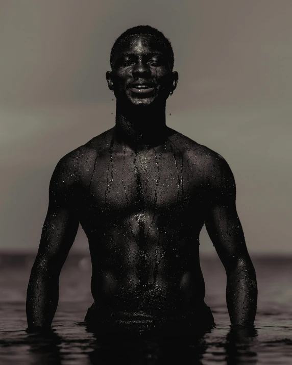 a man standing in the water with  on