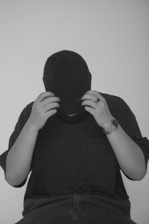 woman covering her face with a mask