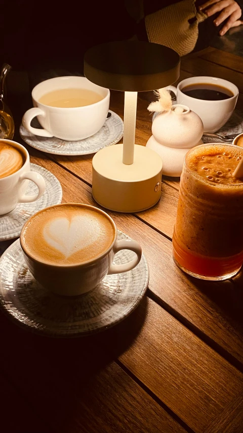 the breakfast plates are on the wooden table