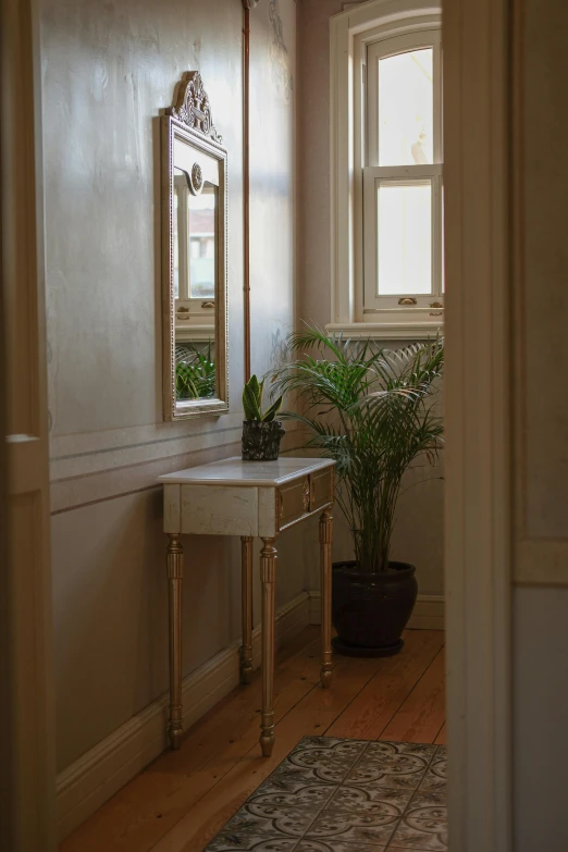 a small mirror sitting on the wall in a room