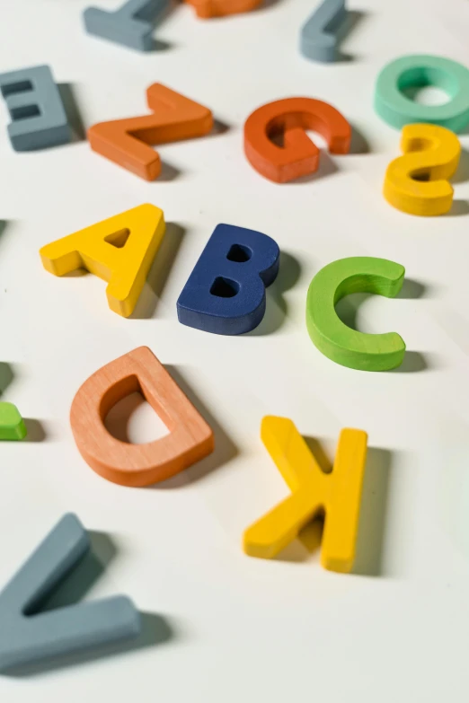 an array of wooden letters spelling out alphabet