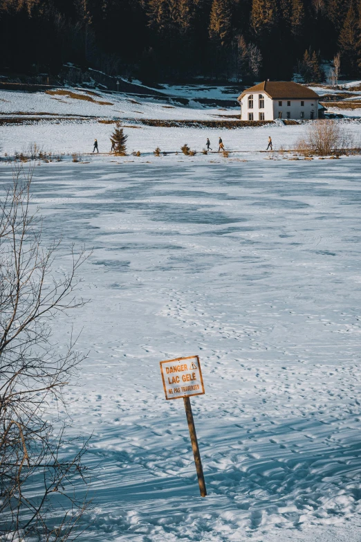 an image of a white snow field with a sign