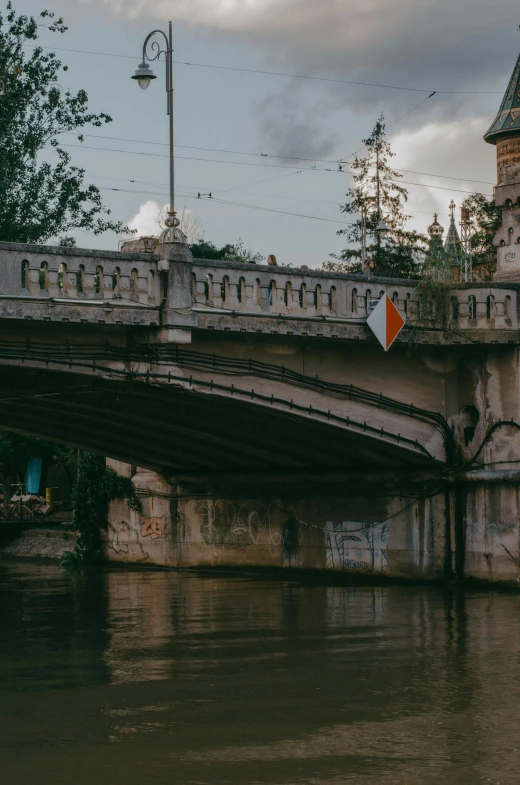 a street light and bridge near water