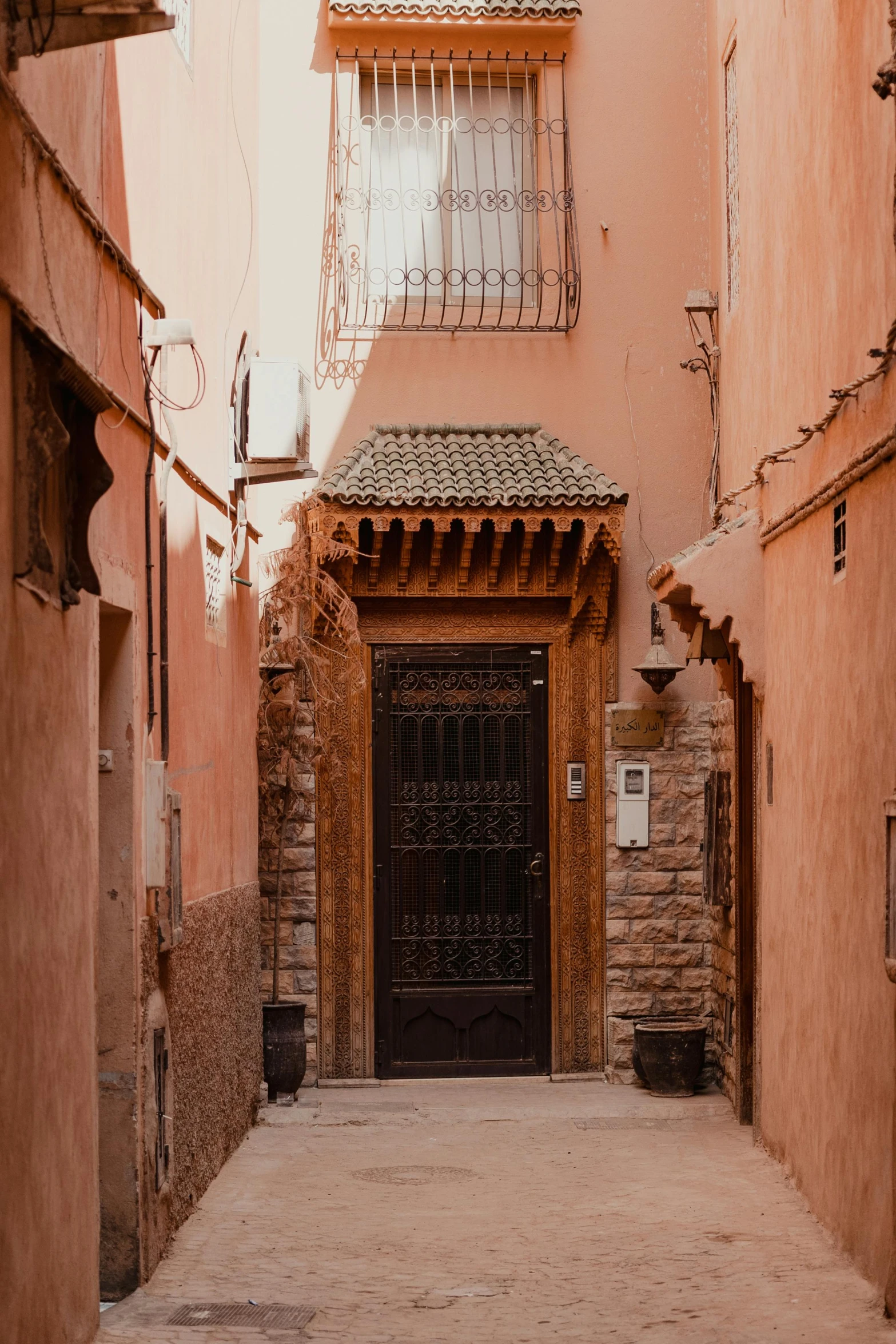 the streets in the old town have tall red walls