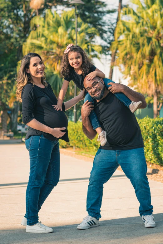 three people are taking a selfie while standing in the park