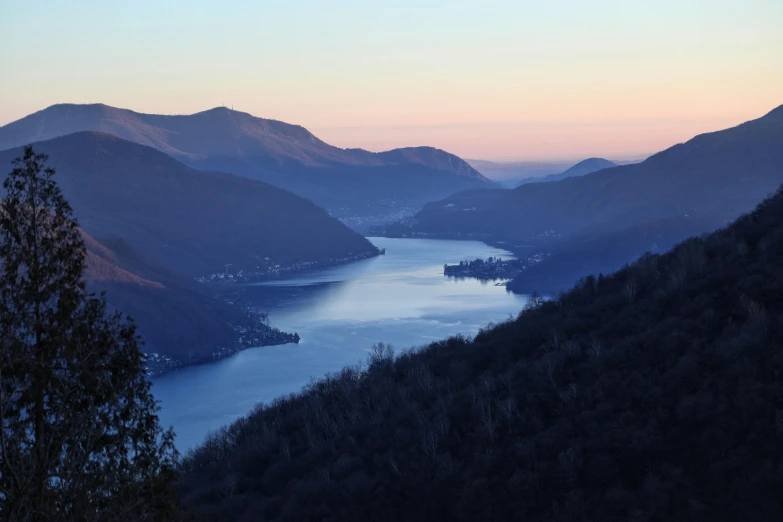 the view of the mountain range and the lake in it