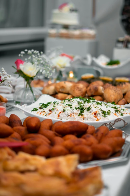 an assortment of desserts sit on tables