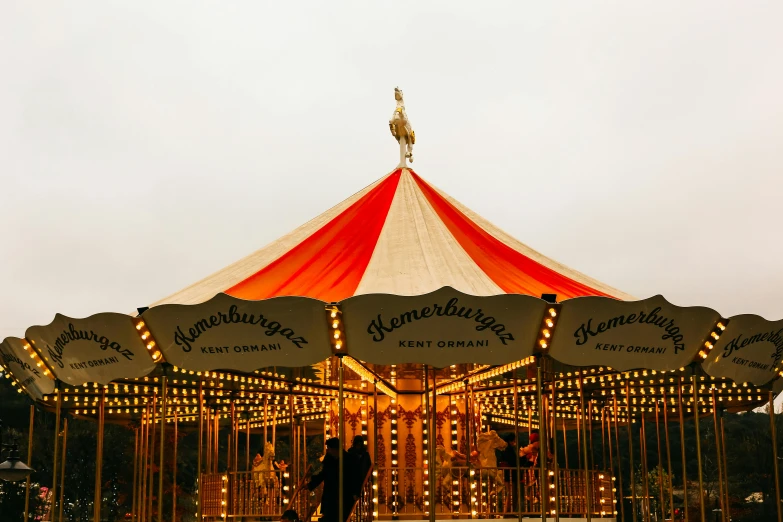 an open field with a carousel at night