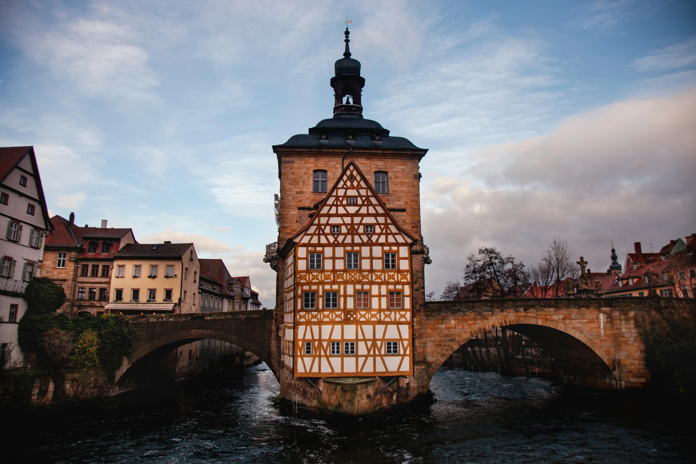 a large old tower sitting in the middle of a river