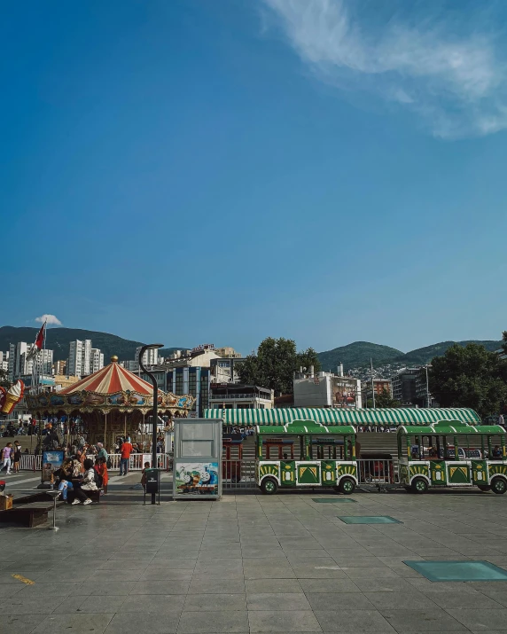 a view of a city with many small carnival stands