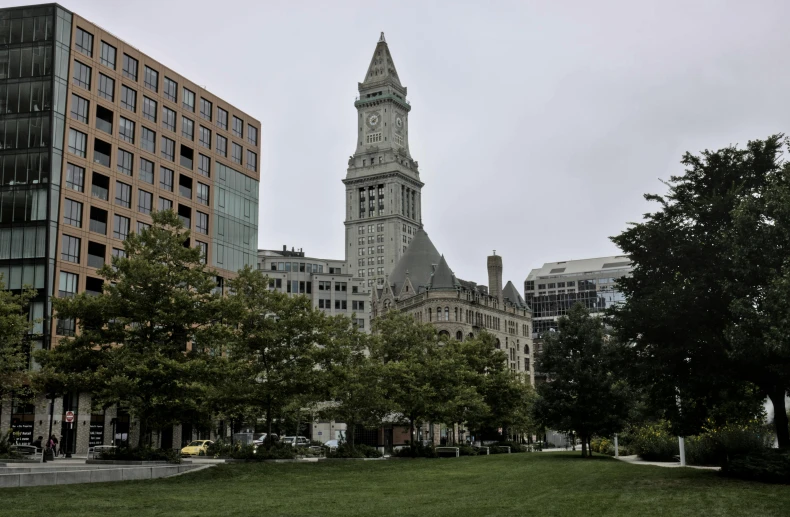 a very large building with a steeple in a city