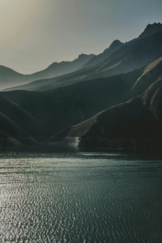 view of a large body of water with mountains in the background