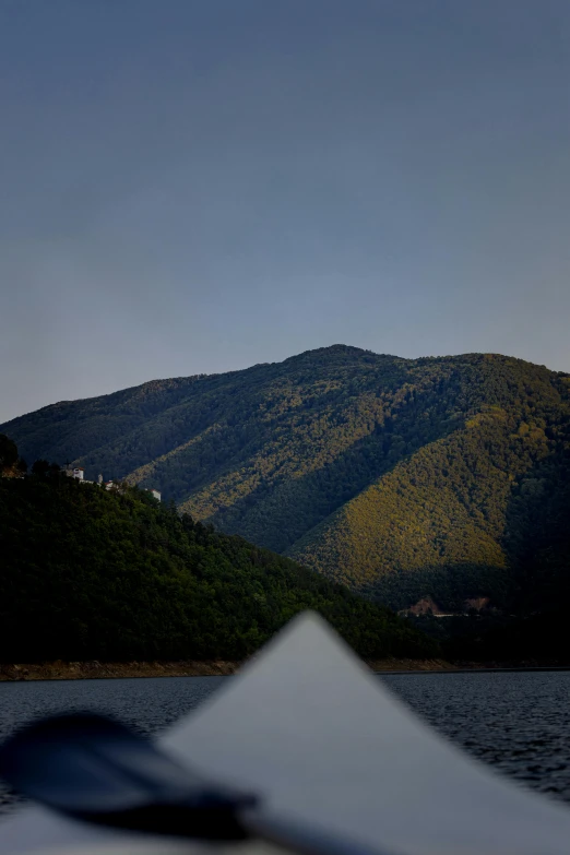 a view of some mountains and water from a boat