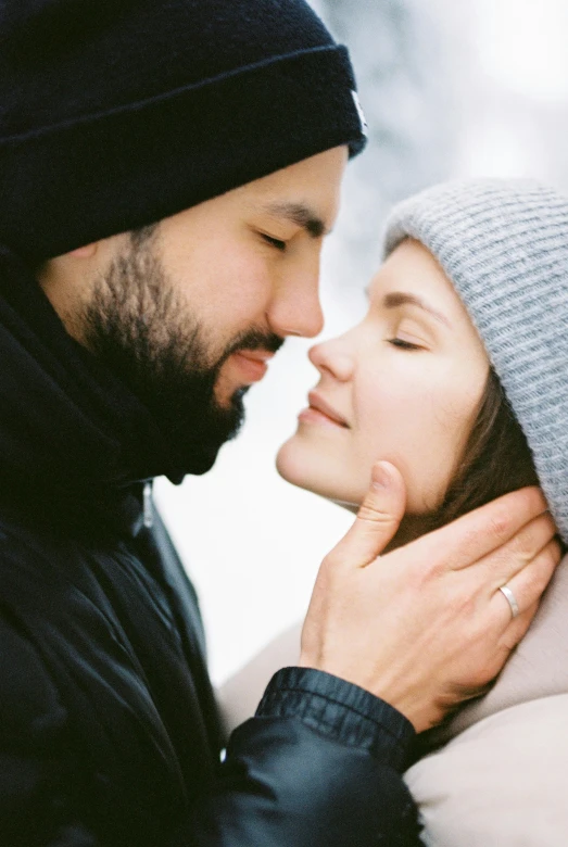 a man with a beard, and a woman wearing a beanie