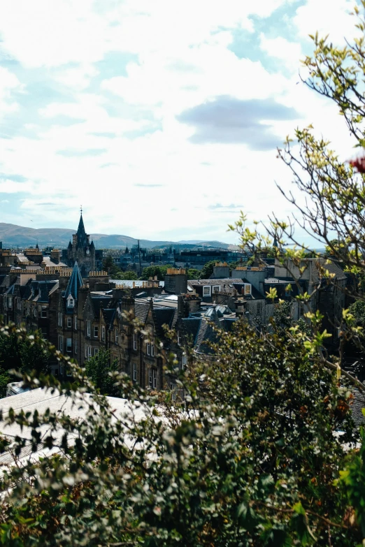 a view of a city from the side of a hill