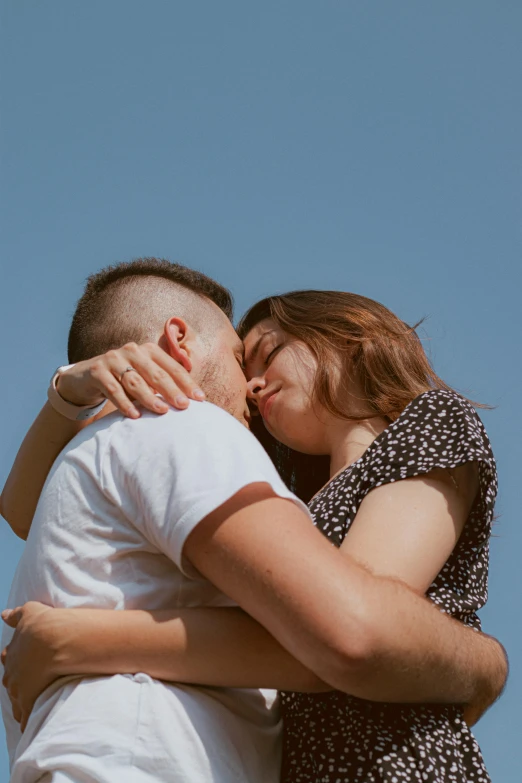 two people emcing with the sky in the background