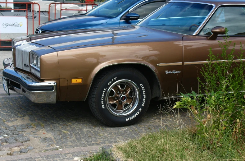 two cars are parked next to each other