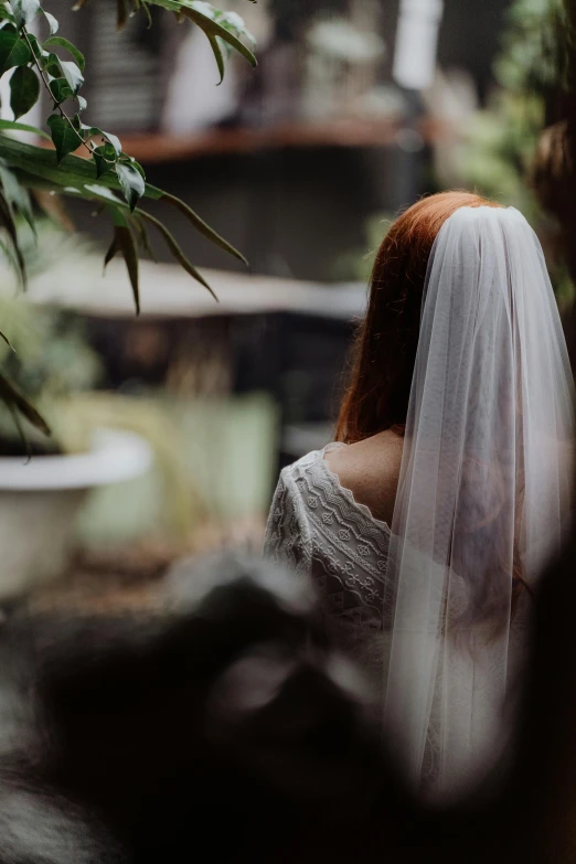 the back of the bride's veil is looking down