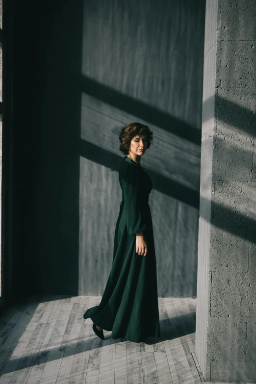 a woman standing in an empty building