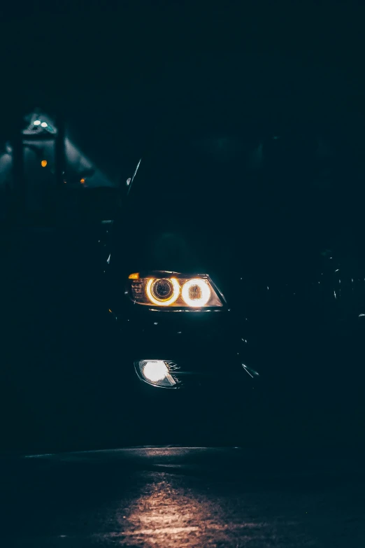 the lights on the front bumper of a car at night