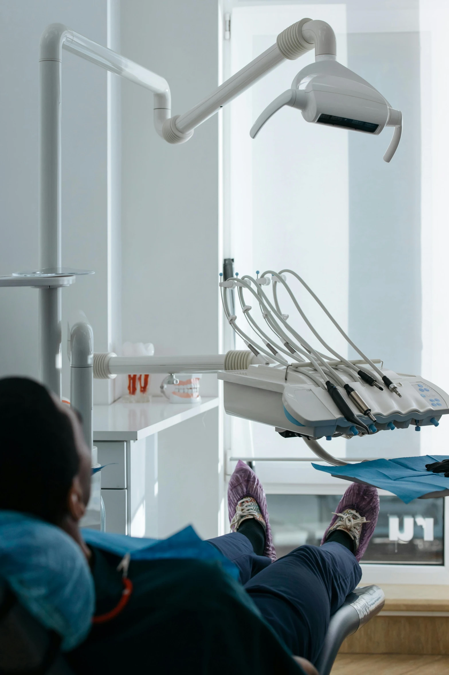 two people in a chair with lights and equipment