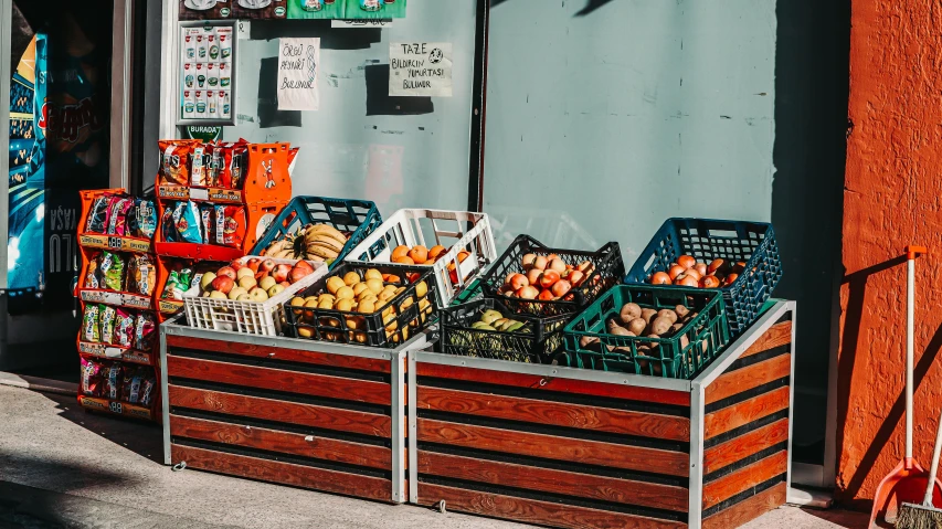 a group of fruit is sitting on display outside