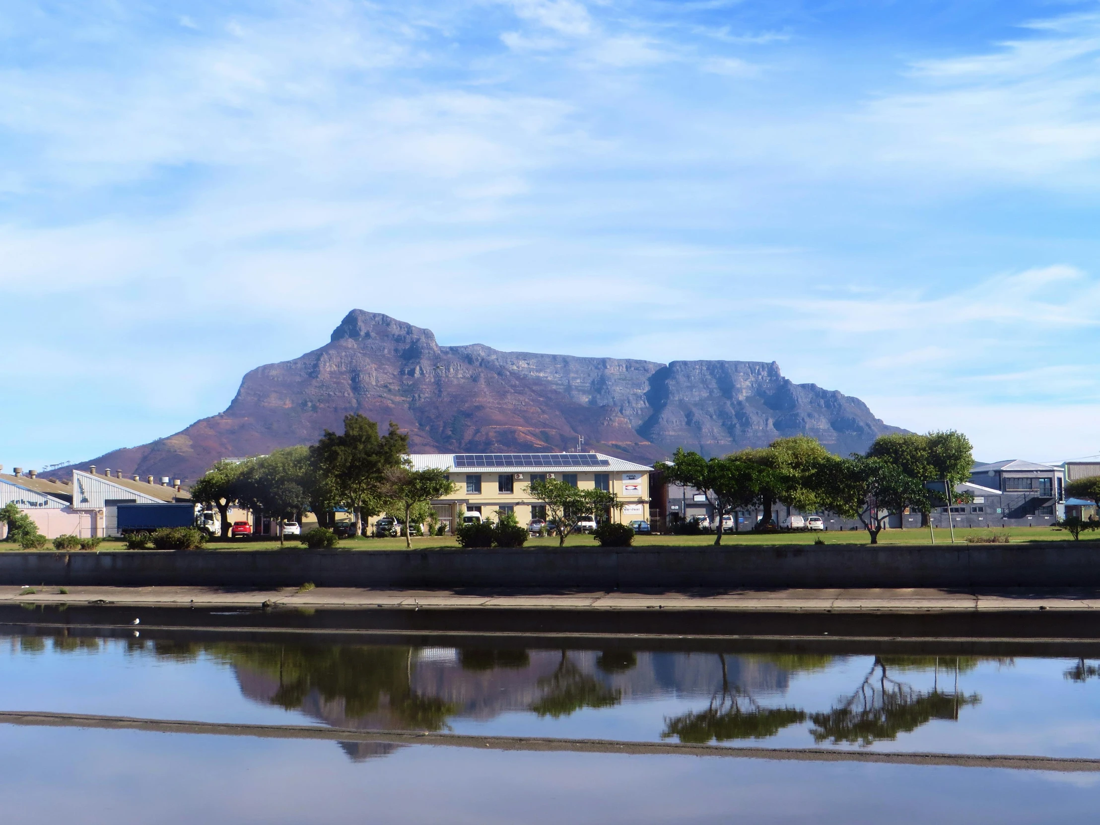 the reflection of a mountain in the water