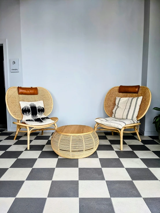 a room that has some chairs and a ottoman