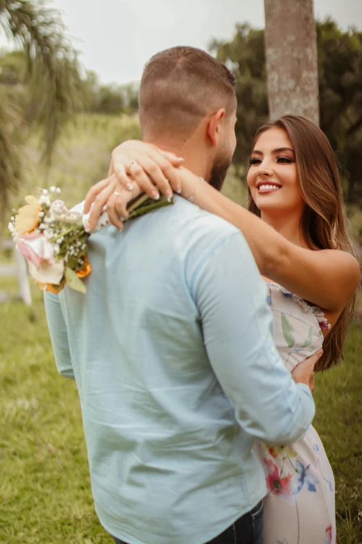 man and woman emcing in a forest after the ceremony