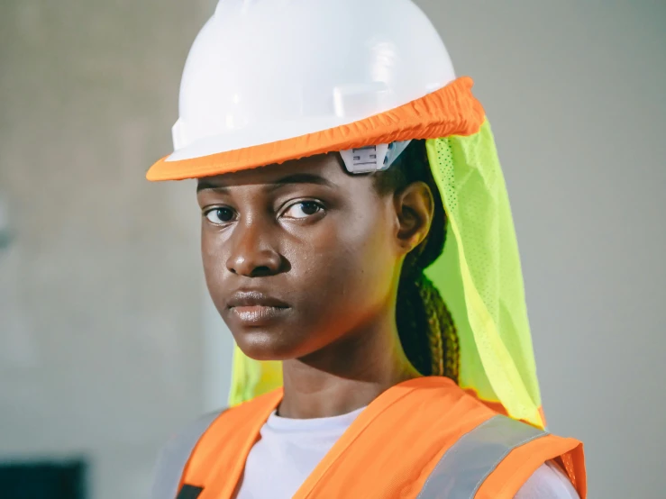 woman in a hard hat and safety vest