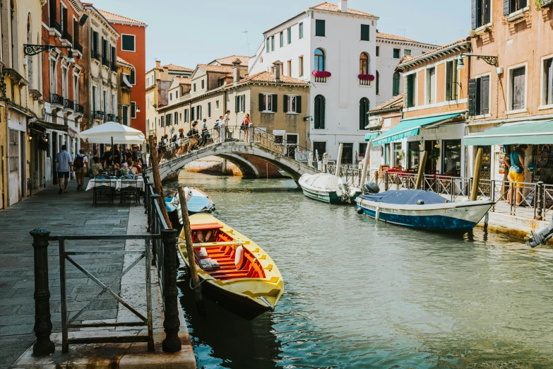 a long boat on a small waterway in a town