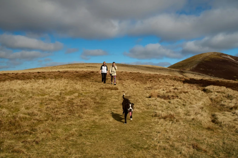 there are people that are walking up the hill