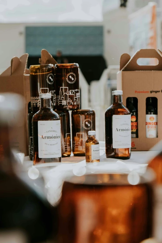 bottles of wine sit on a table with a box