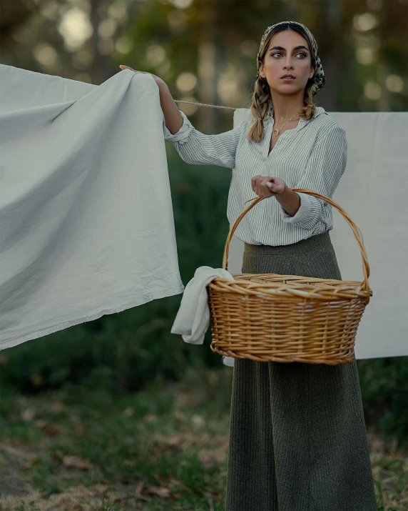 a woman with a basket holding a cloth