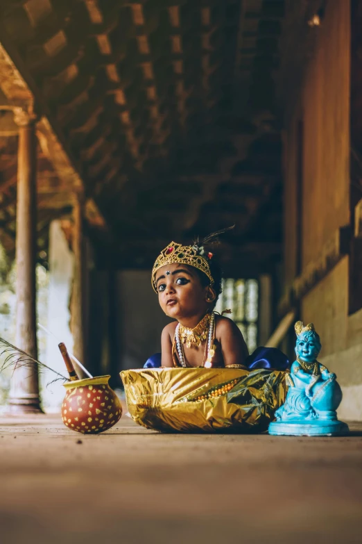 a  sitting next to a statue and food